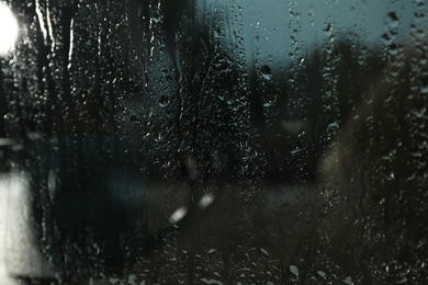 Photo of Blurred view from window on rainy day