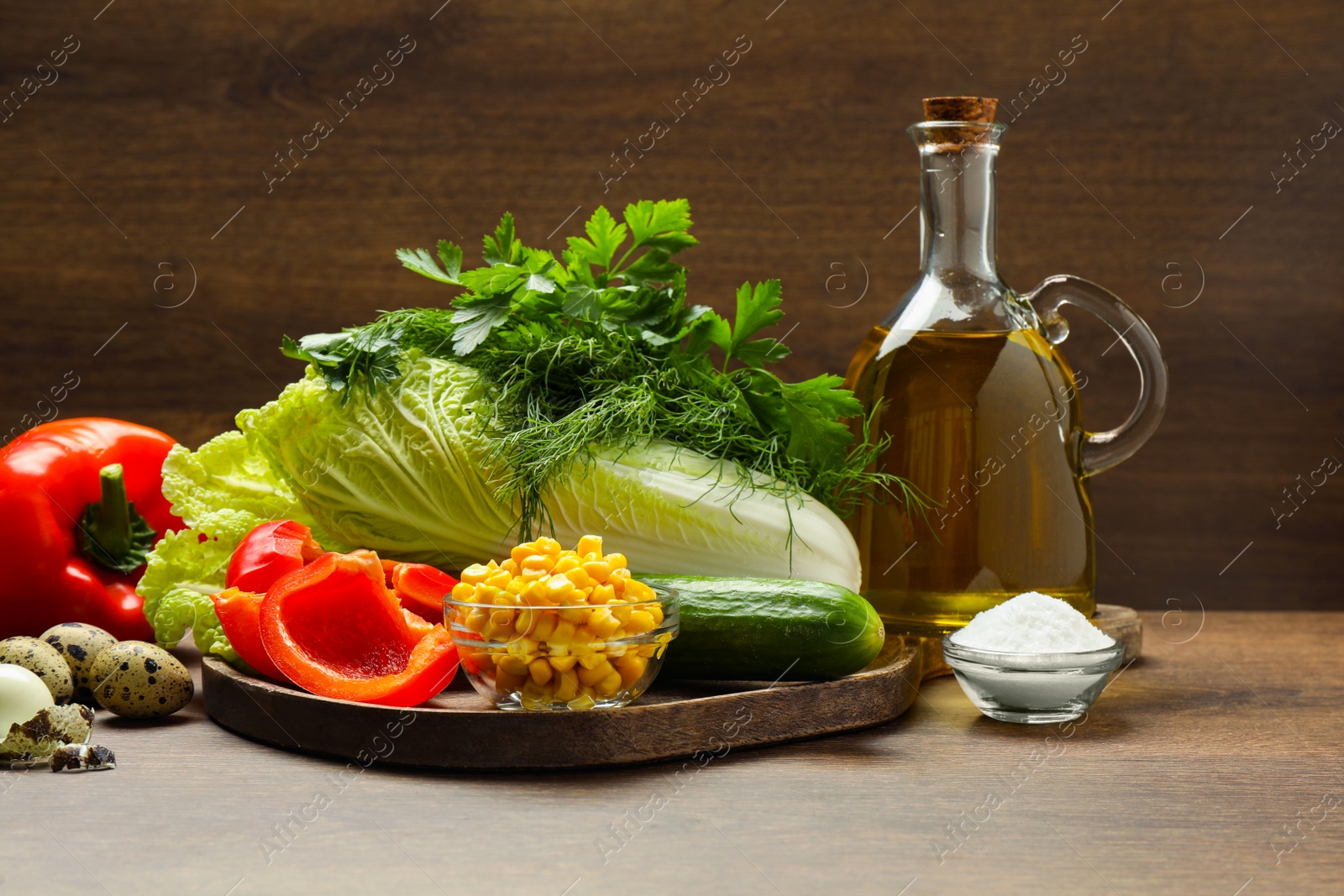 Photo of Chinese cabbage and different products on wooden table