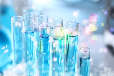 Image of Many test tubes with samples, closeup. Laboratory glassware