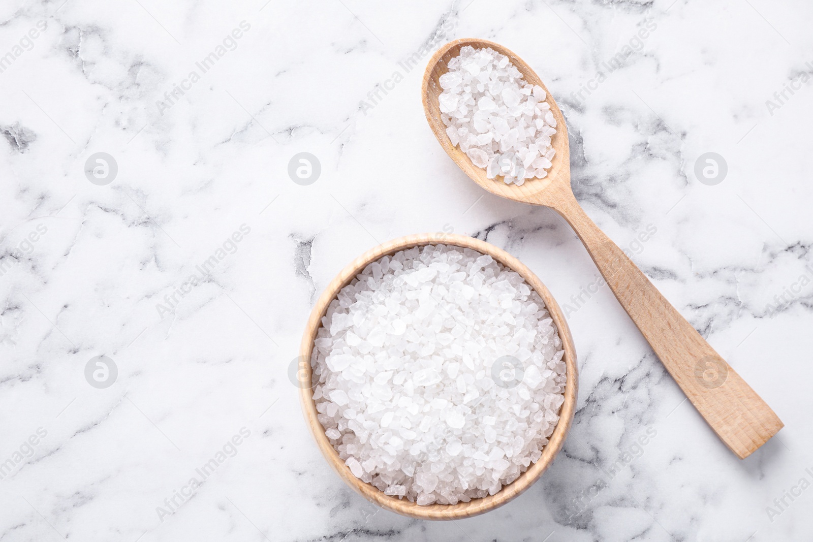 Photo of Flat lay composition with white sea salt on marble background, space for text. Spa treatment