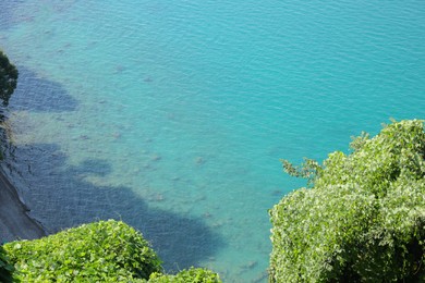 Picturesque view of green hills and sea with boat