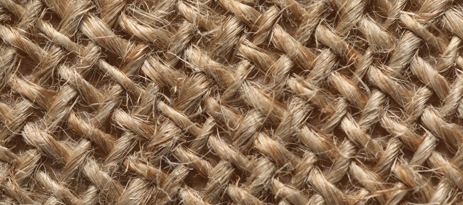 Photo of Texture of light brown fabric as background, top view