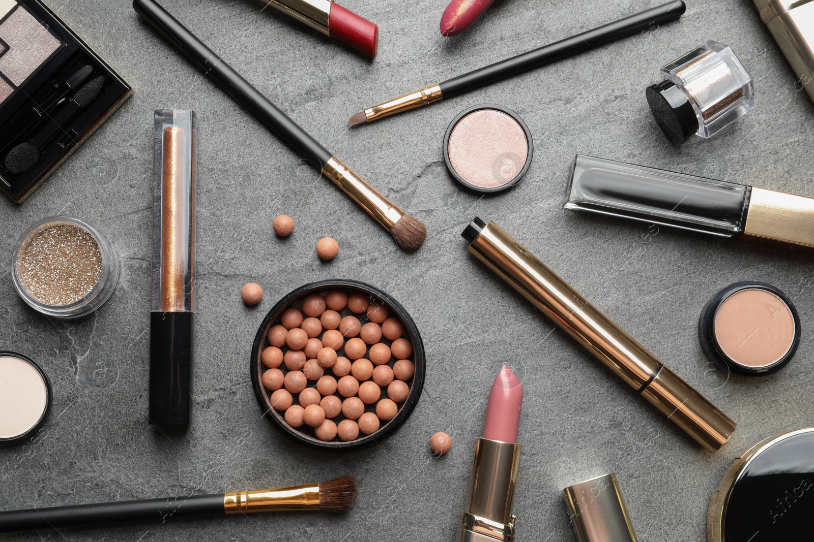 Photo of Set of luxury makeup products on grey background, flat lay