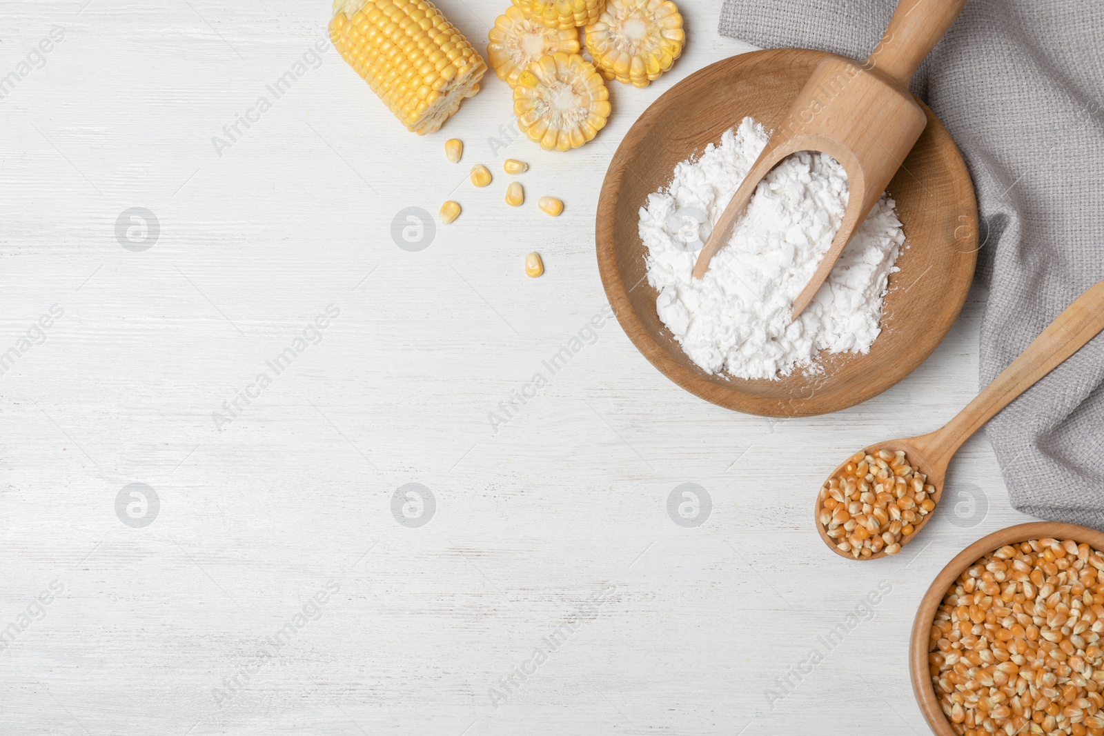 Photo of Flat lay composition with corn starch and space for text on white wooden background