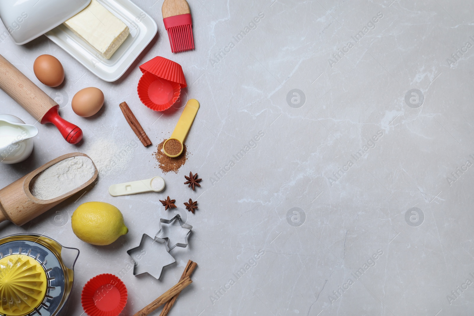 Photo of Cooking utensils and ingredients on light marble table, flat lay. Space for text