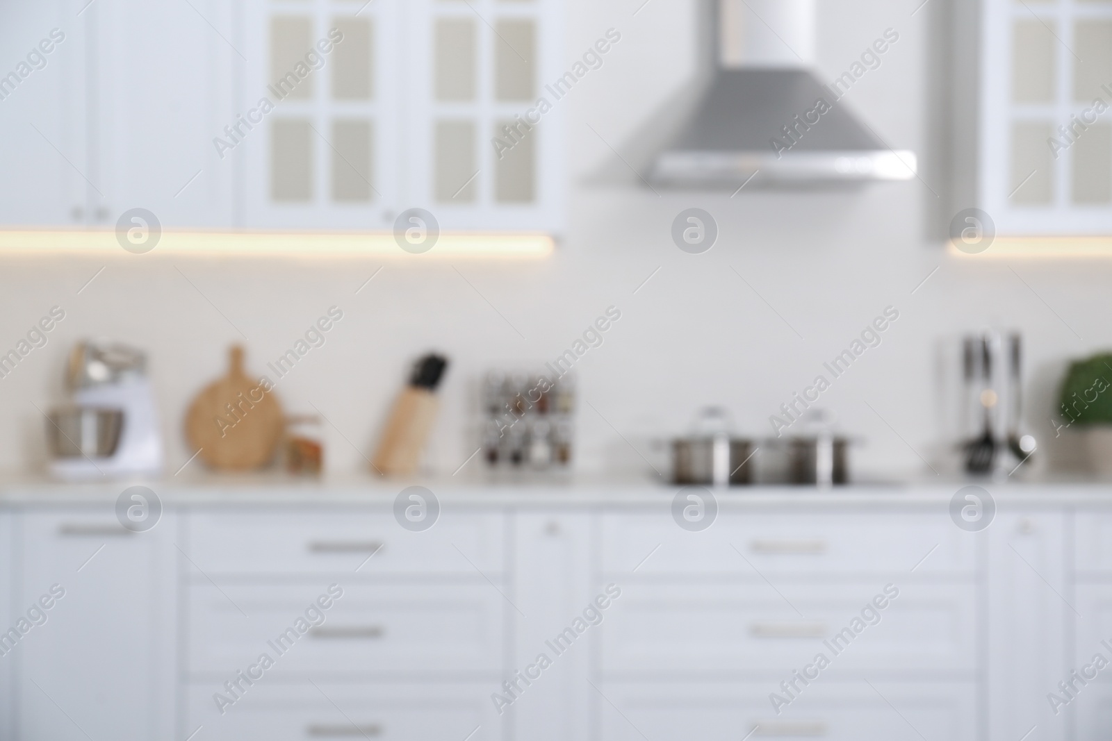 Photo of Blurred view of modern stylish kitchen interior