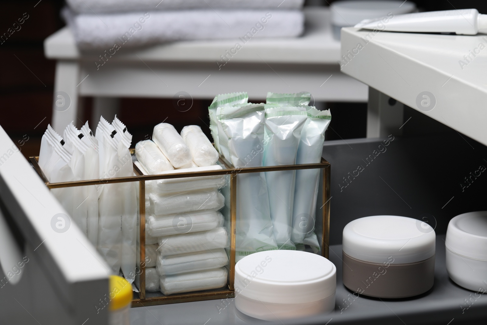 Photo of Storage of different feminine and personal care products in drawer, closeup