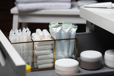 Photo of Storage of different feminine and personal care products in drawer, closeup