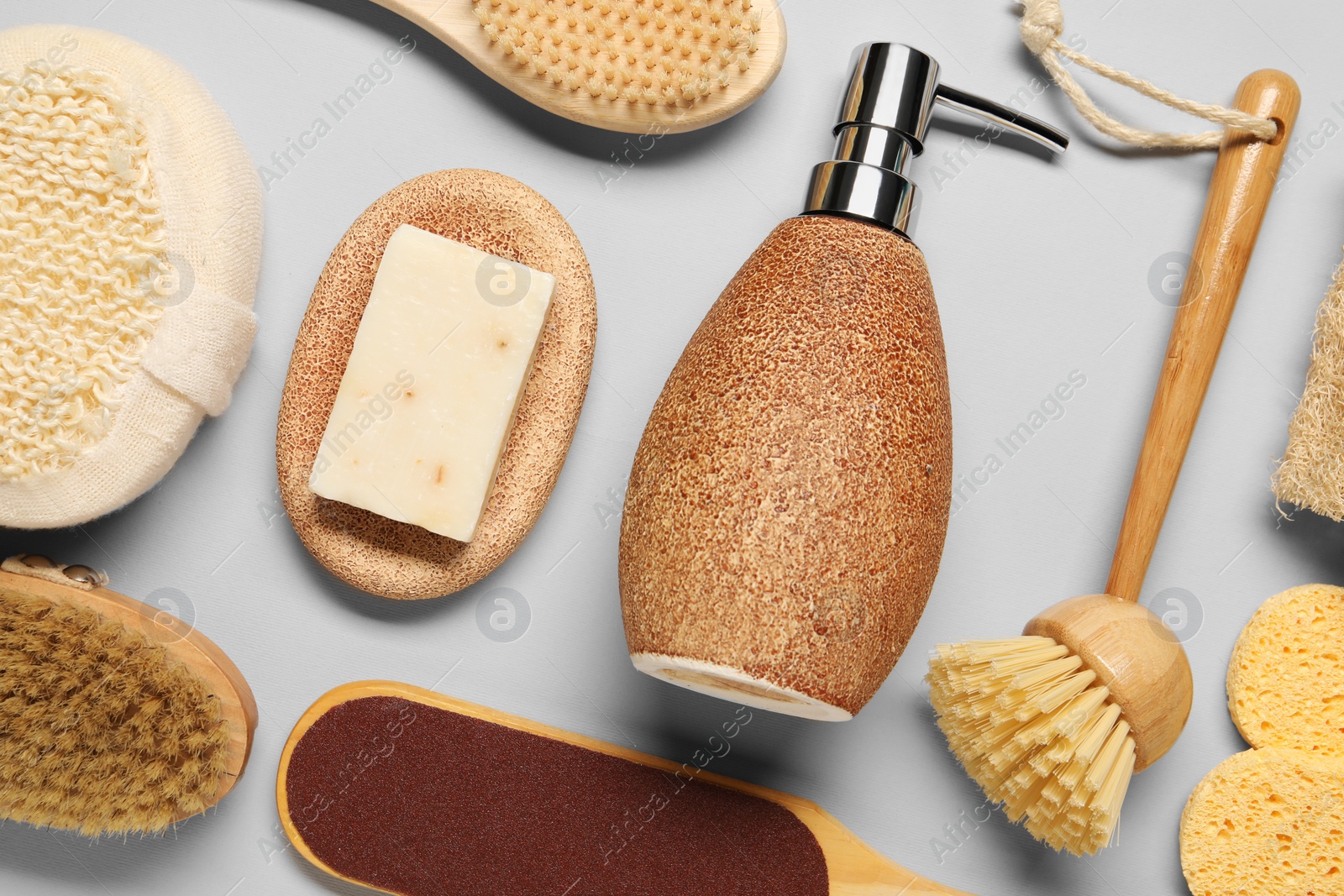 Photo of Bath accessories. Flat lay composition with personal care tools on light grey background