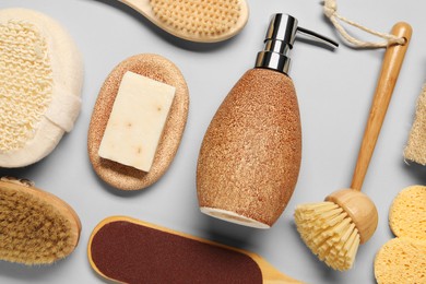 Bath accessories. Flat lay composition with personal care tools on light grey background