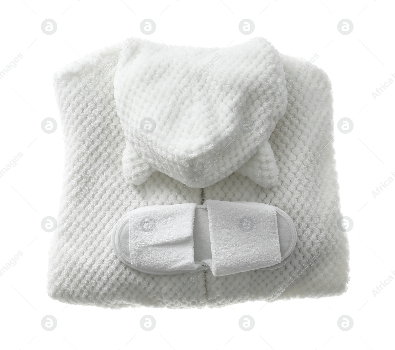 Photo of Clean folded bathrobe and slippers isolated on white, top view