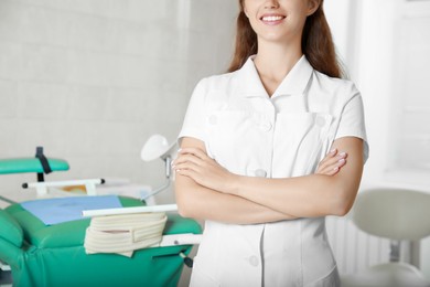 Photo of Young gynecologist at workplace in clinic, closeup. Space for text