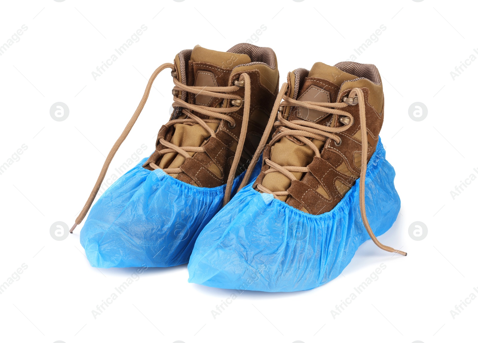 Photo of Boots in blue shoe covers isolated on white