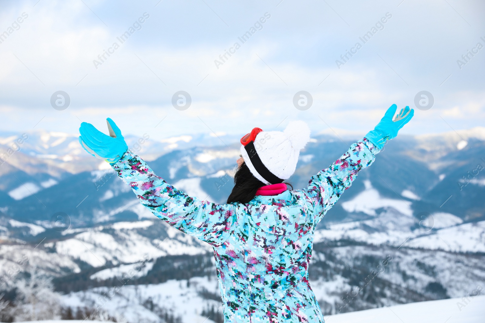 Photo of Young woman at mountain resort. Winter vacation