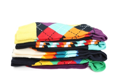 Photo of Many new colorful socks on white background