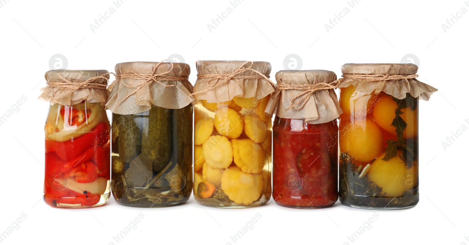 Photo of Different jars with pickled vegetables on white background