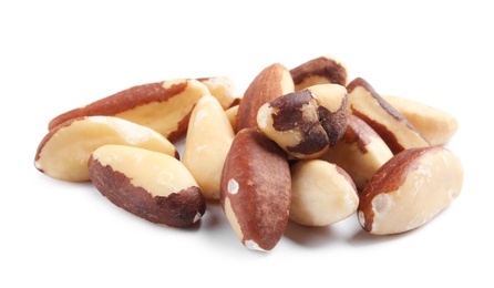 Photo of Delicious Brazil nuts on white background. Healthy snack