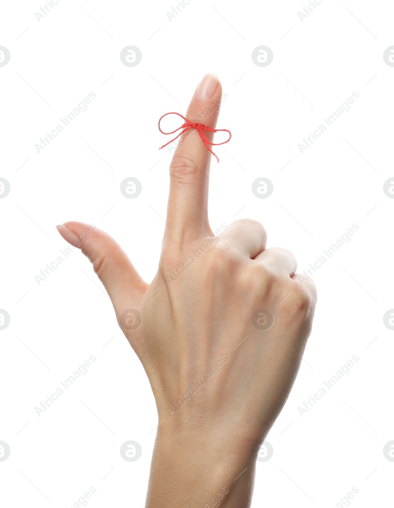 Photo of Woman showing index finger with tied red bow as reminder on white background, closeup