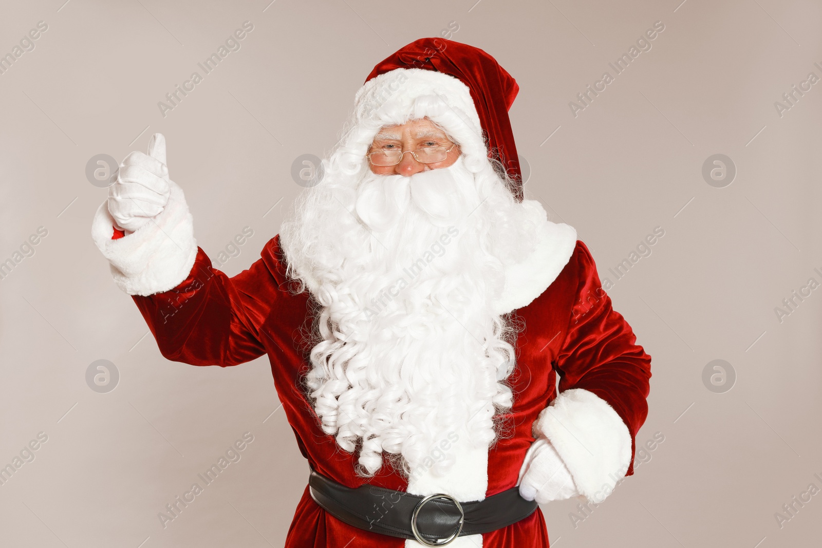 Photo of Happy authentic Santa Claus on grey background