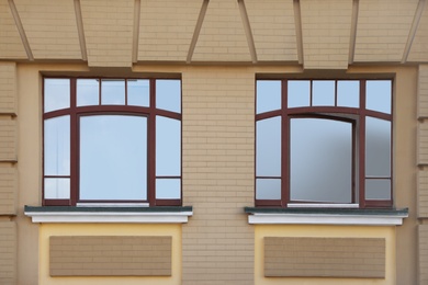 Wall of building with stylish tinted windows