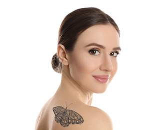 Young woman with beautiful tattoo of butterfly on her body against white background