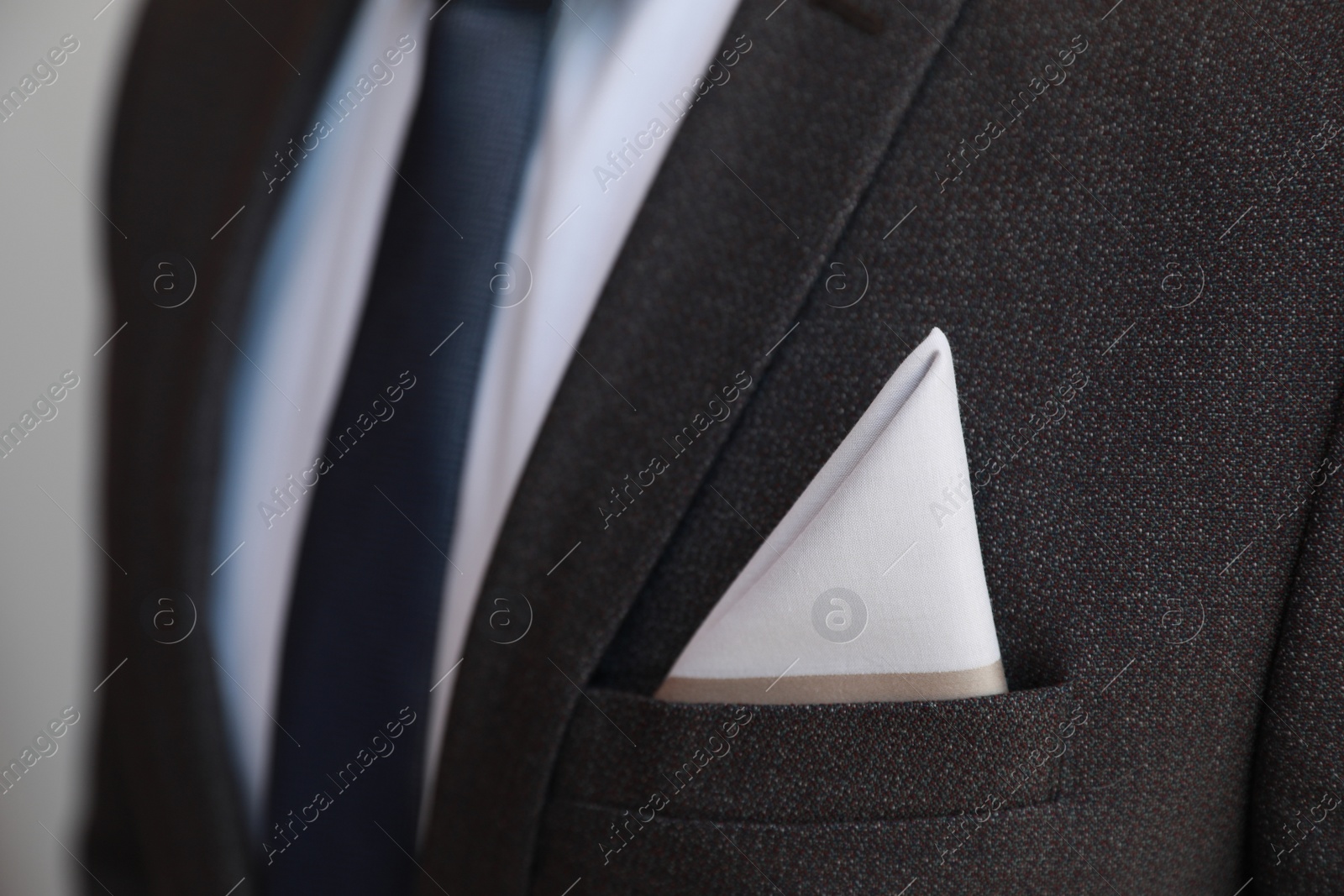 Photo of Man with handkerchief in suit pocket, closeup view