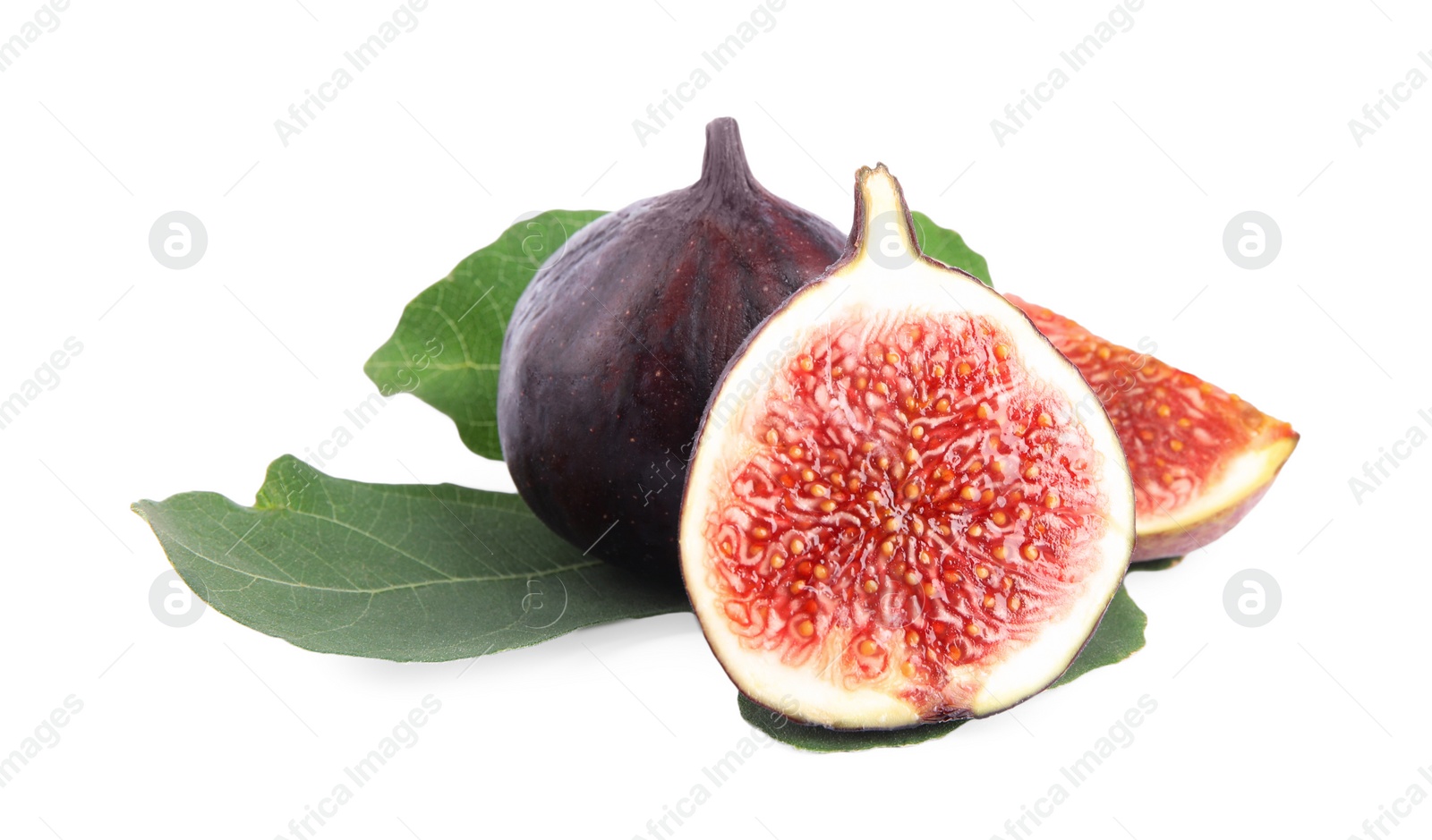 Photo of Fresh juicy purple figs and green leaves on white background