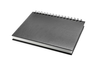 Photo of One notebook with black cover isolated on white