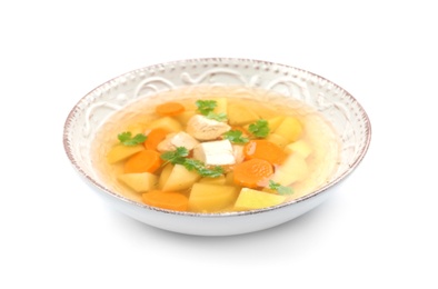 Dish with fresh homemade chicken soup on white background