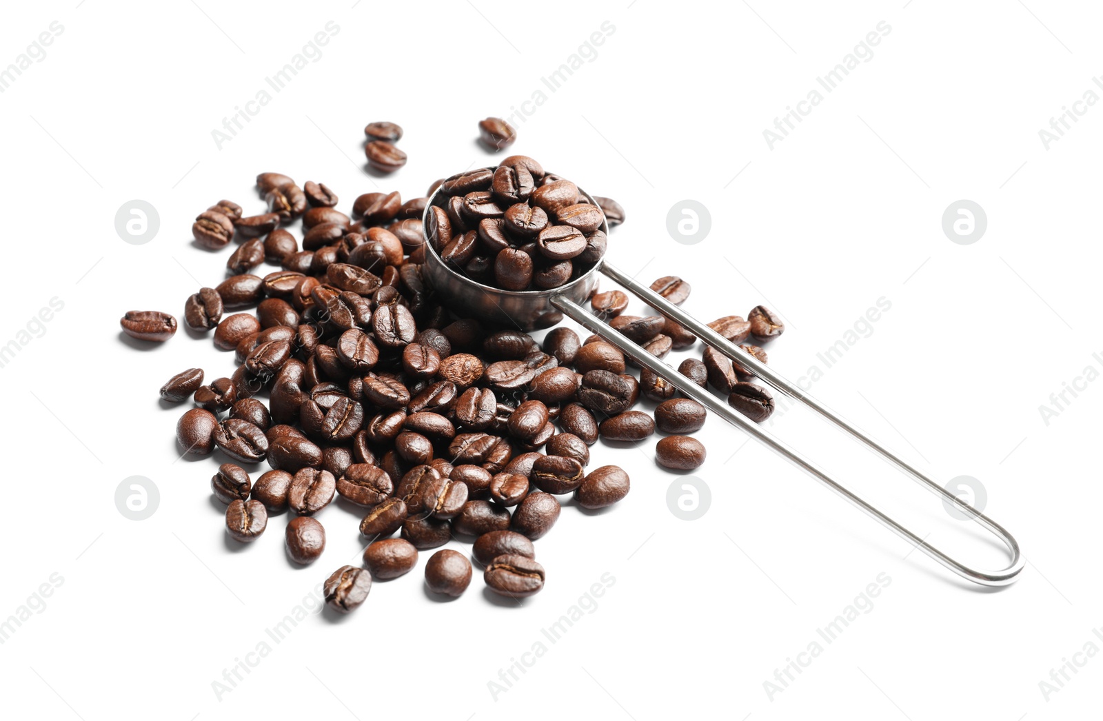 Photo of Scoop and roasted coffee beans on white background