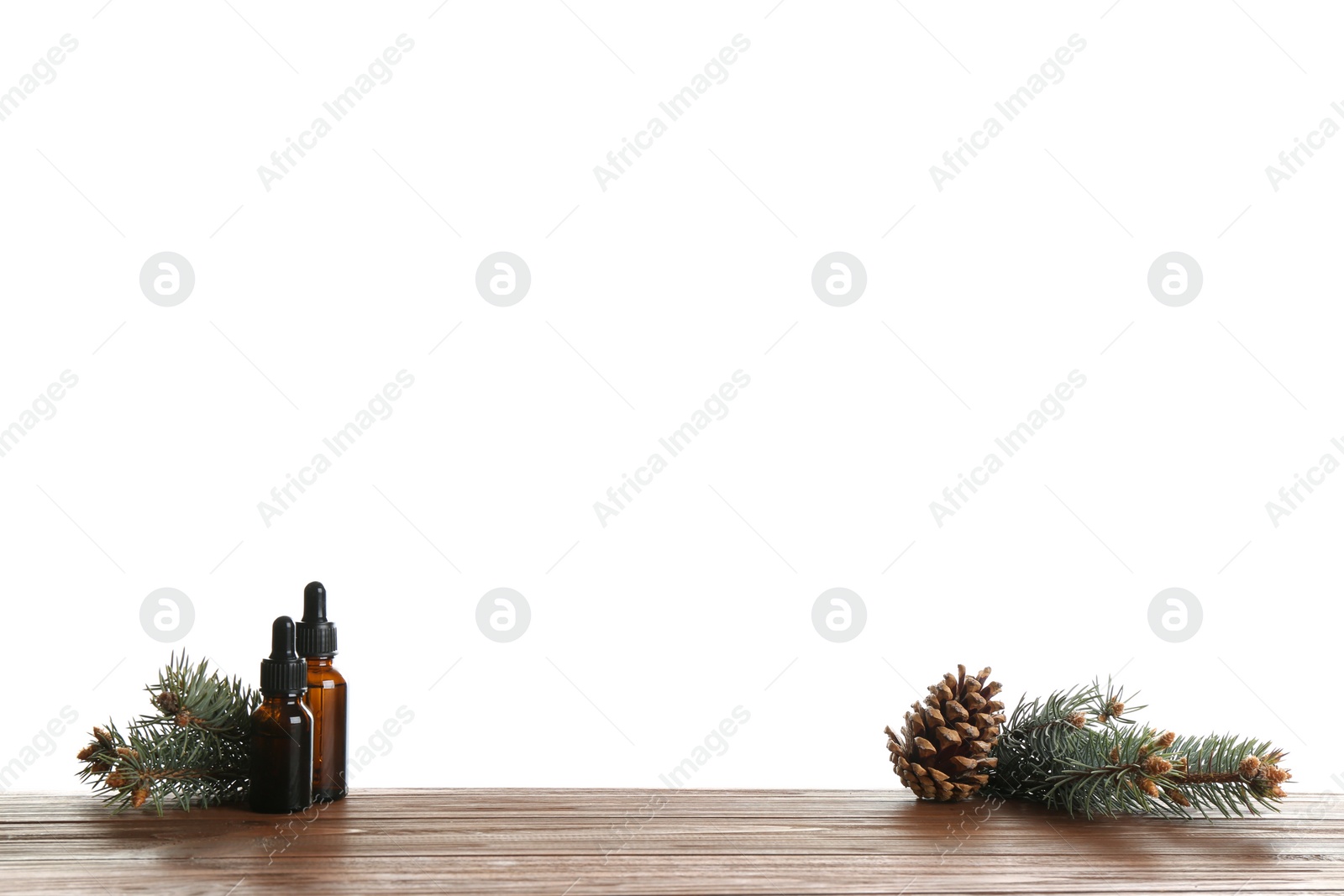 Photo of Composition with bottles of conifer essential oil on table against white background. Space for text