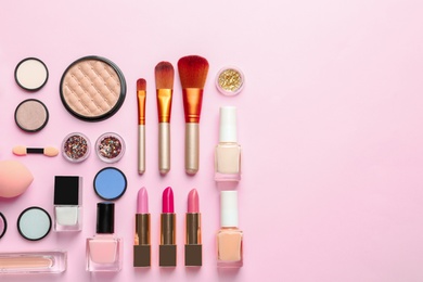 Flat lay composition with decorative cosmetics on color background