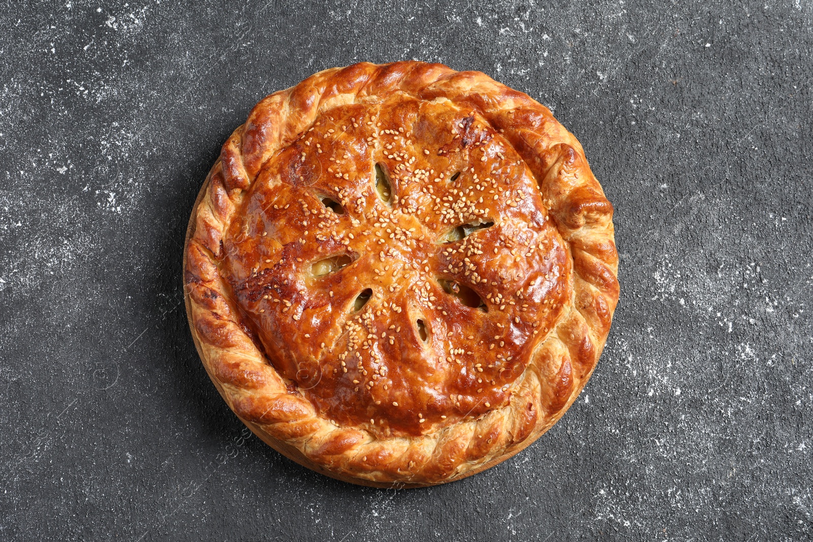 Photo of Tasty homemade pie on grey table, top view