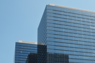 Skyscrapers in city center on sunny day. Modern architectural design