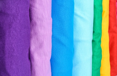 Photo of Many trendy colorful t-shirts, close up view