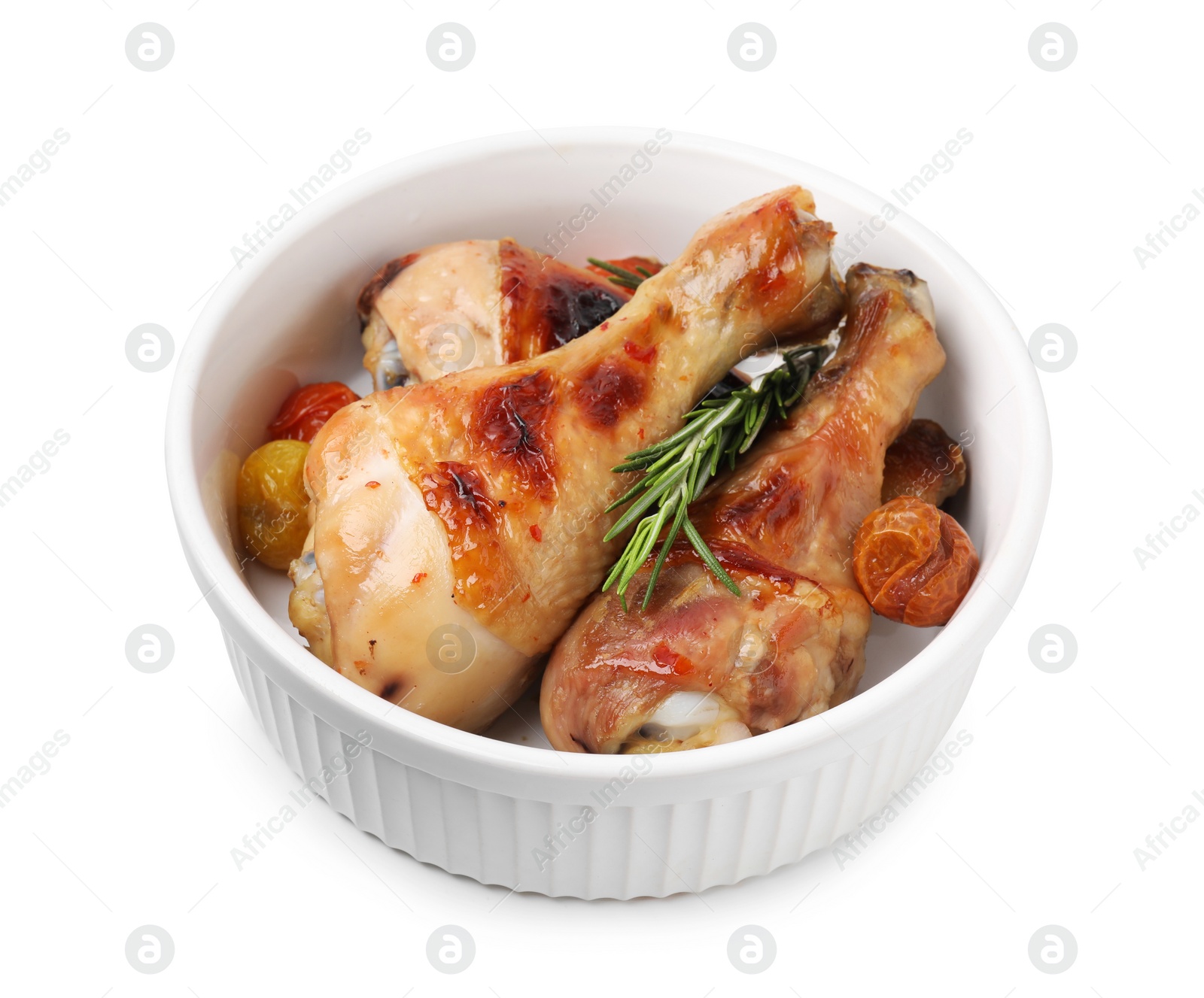 Photo of Delicious roasted chicken drumsticks with rosemary and tomatoes in bowl isolated on white