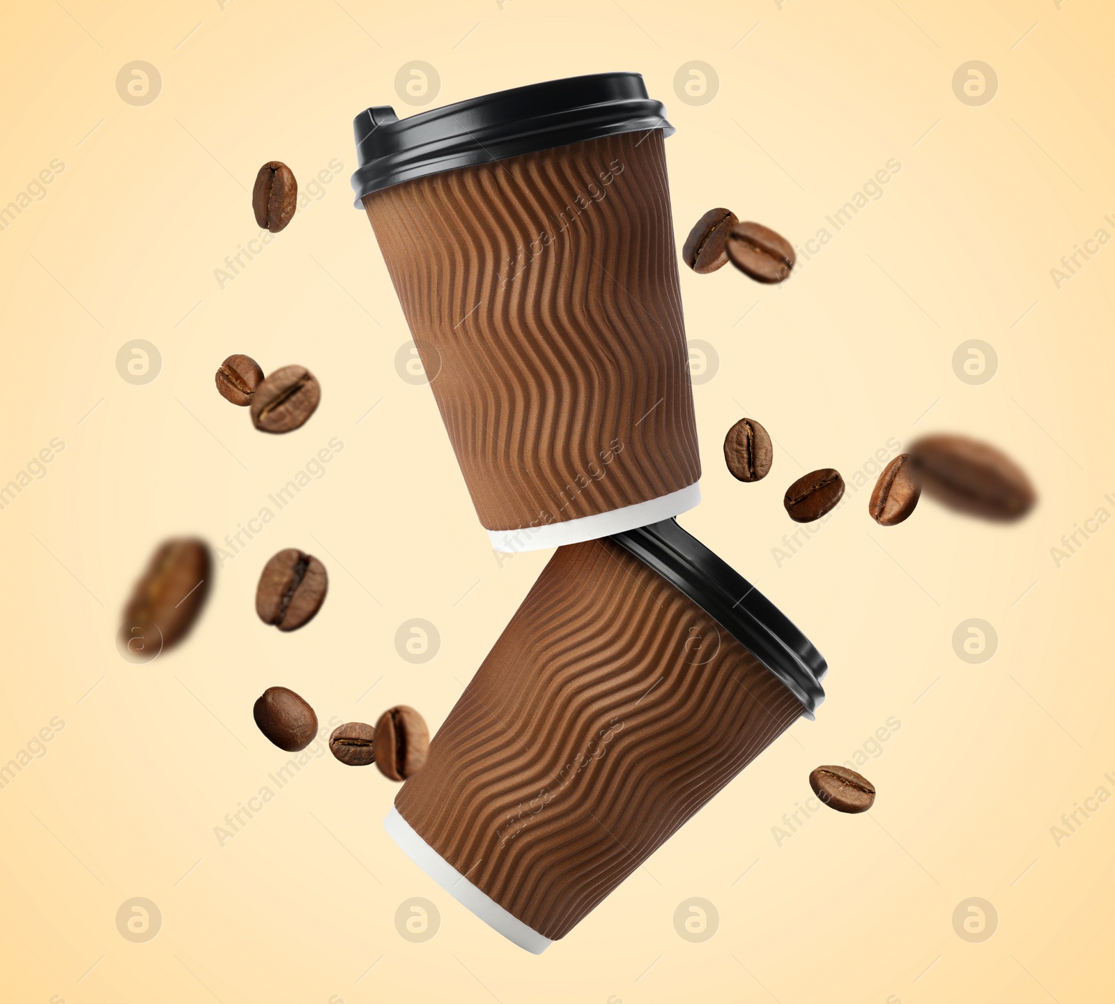 Image of Coffee to go. Paper cups and roasted beans flying on beige background