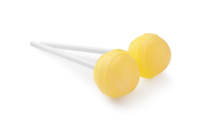 Photo of Two sweet yellow lollipops isolated on white