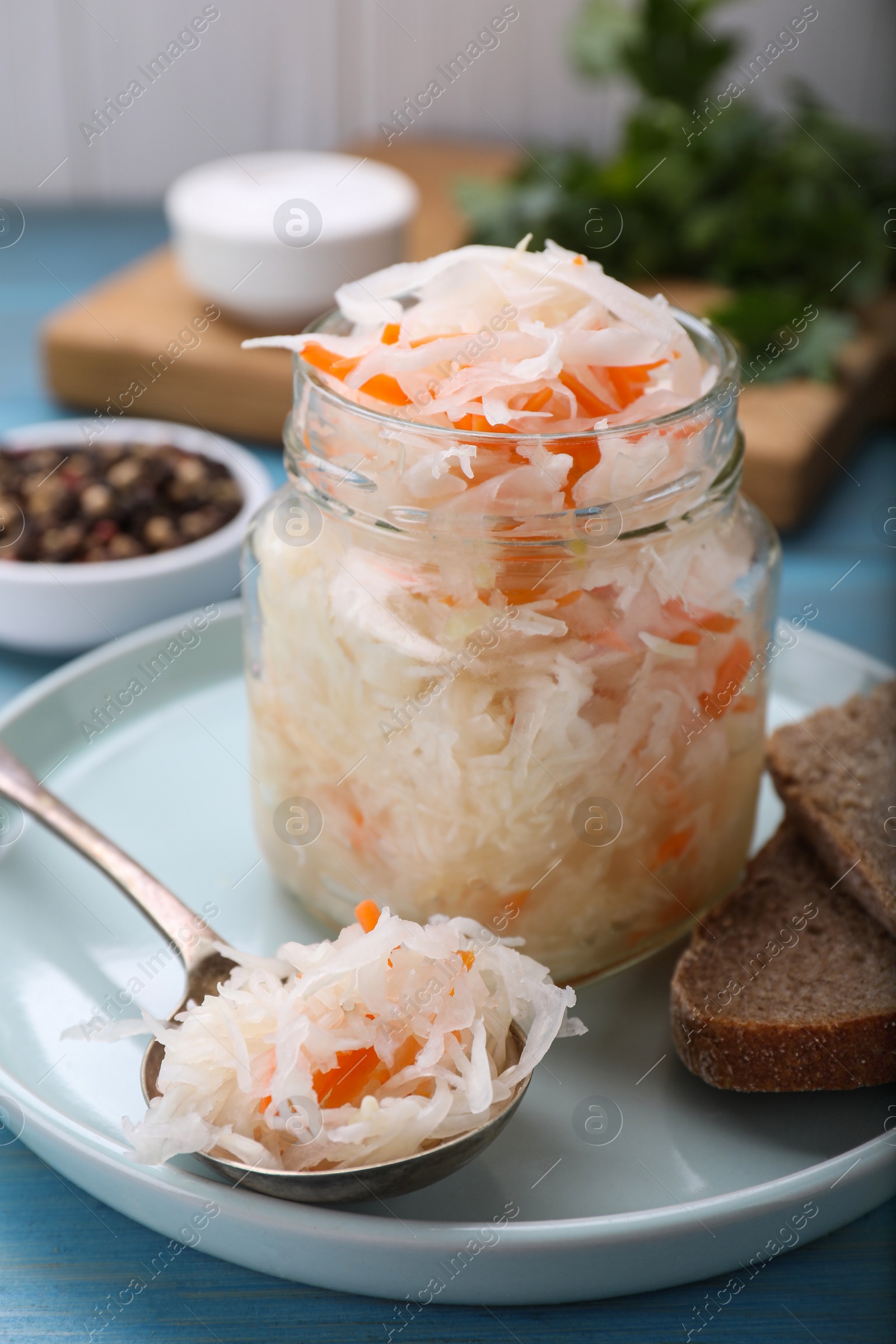 Photo of Tasty sauerkraut in jar on table, closeup