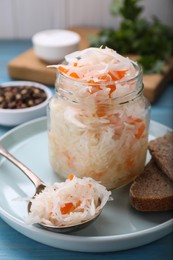 Tasty sauerkraut in jar on table, closeup