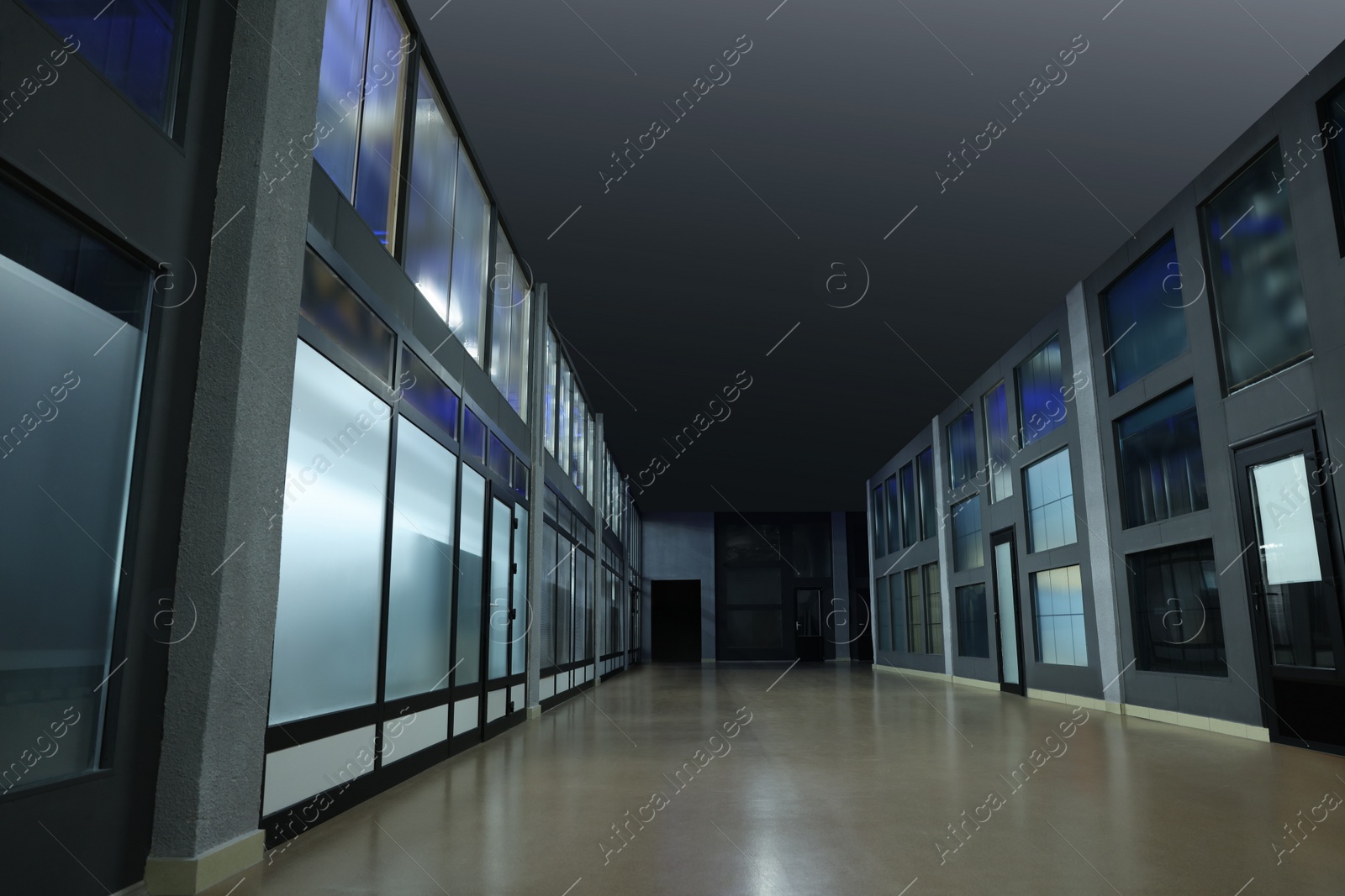 Photo of Modern empty office corridor with glass walls