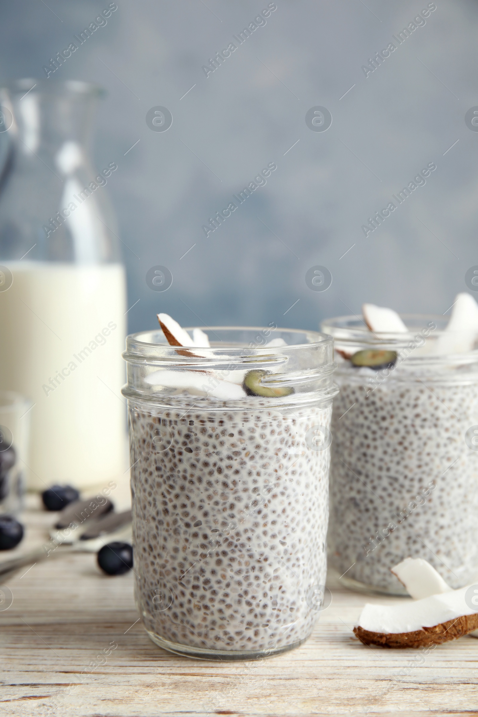 Photo of Tasty chia seed pudding with coconut on table