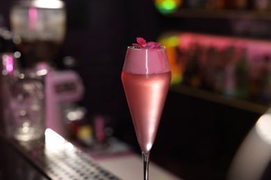 Photo of Fresh alcoholic cocktail on blurred background, closeup