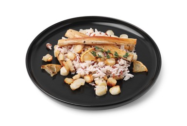 Photo of Plate with baked salsify roots, lemon and rice isolated on white