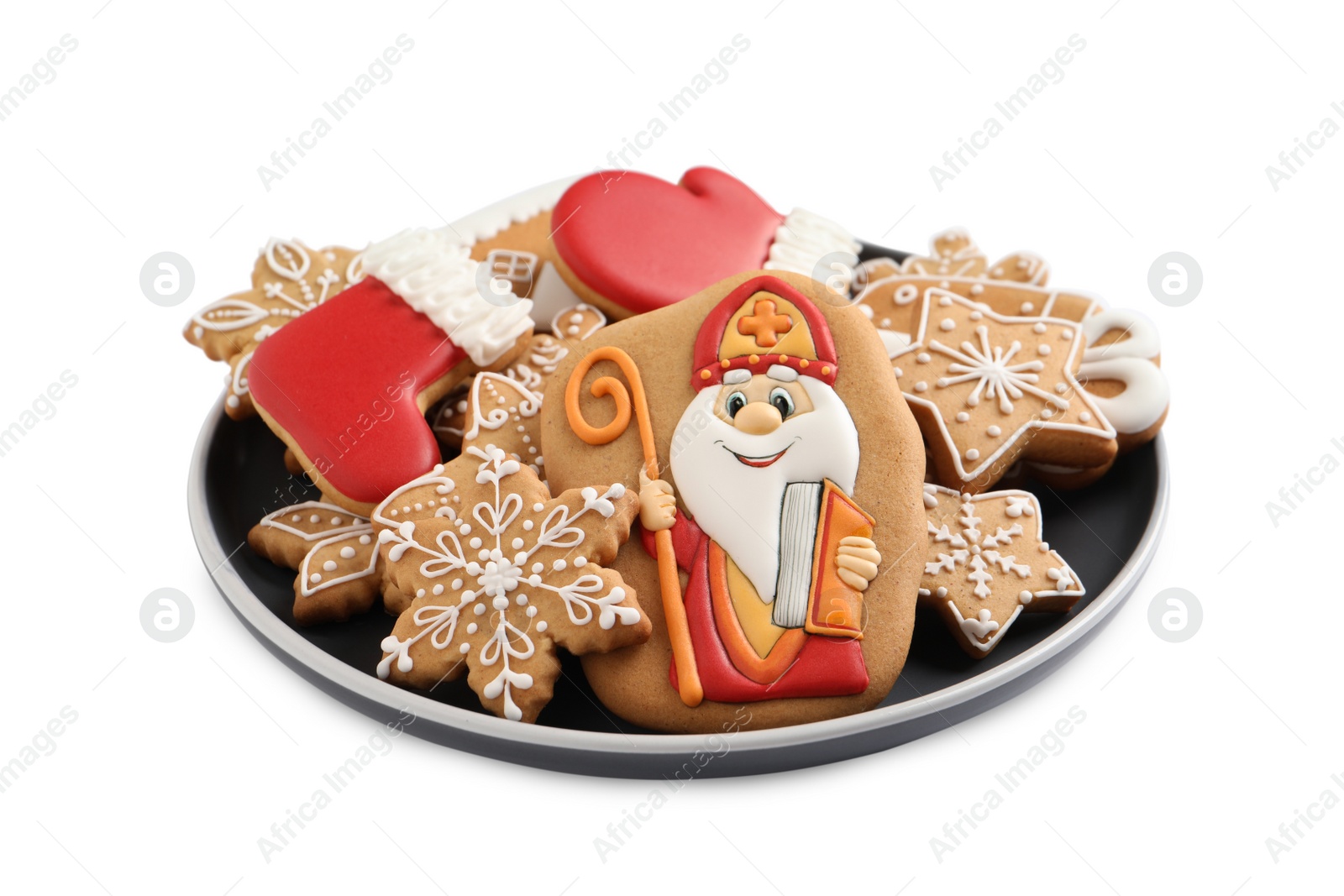 Photo of Tasty gingerbread cookies on white background. St. Nicholas Day celebration