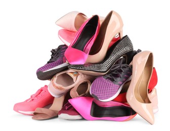 Pile of different female shoes isolated on white