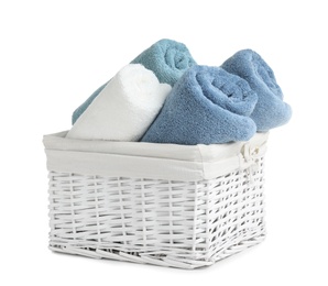 Basket with rolled towels isolated on white