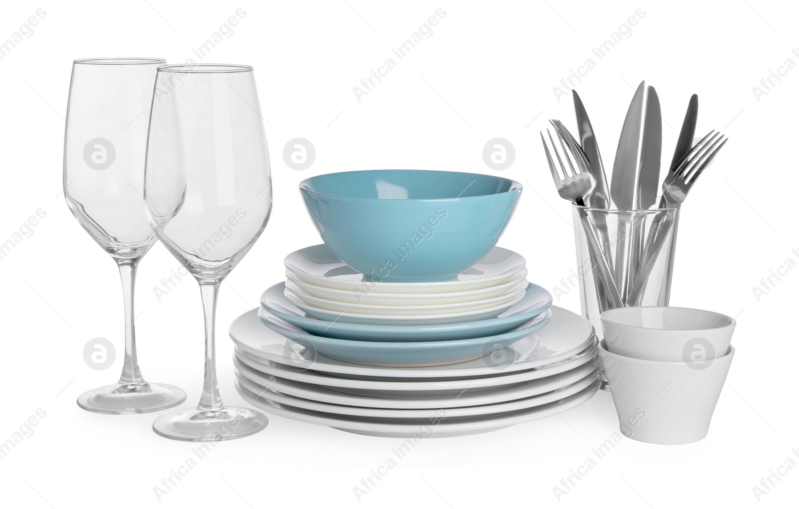 Photo of Set of beautiful ceramic dishware, glasses and cutlery isolated on white