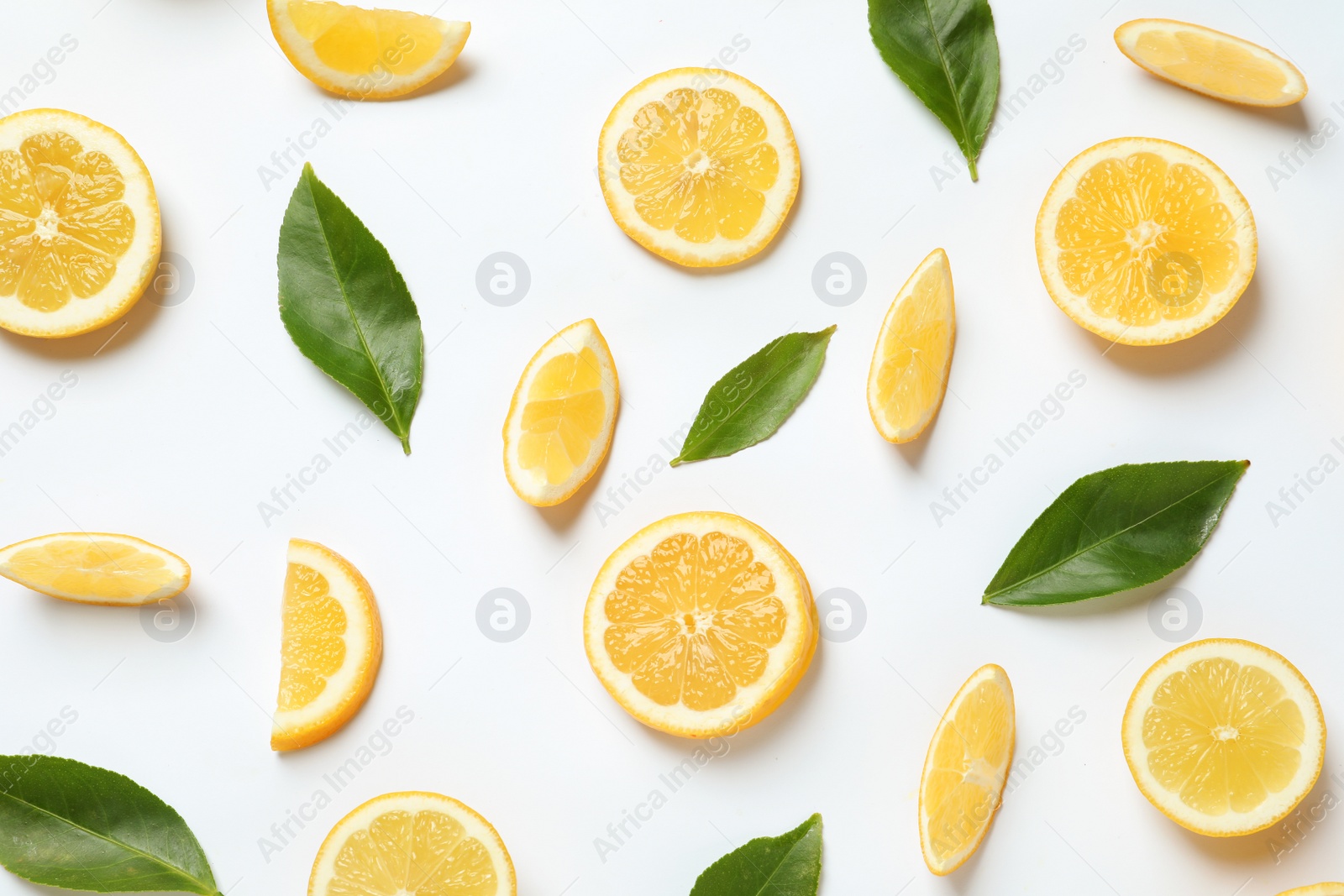 Photo of Fresh lemons and leaves on white background, top view. Citrus fruits