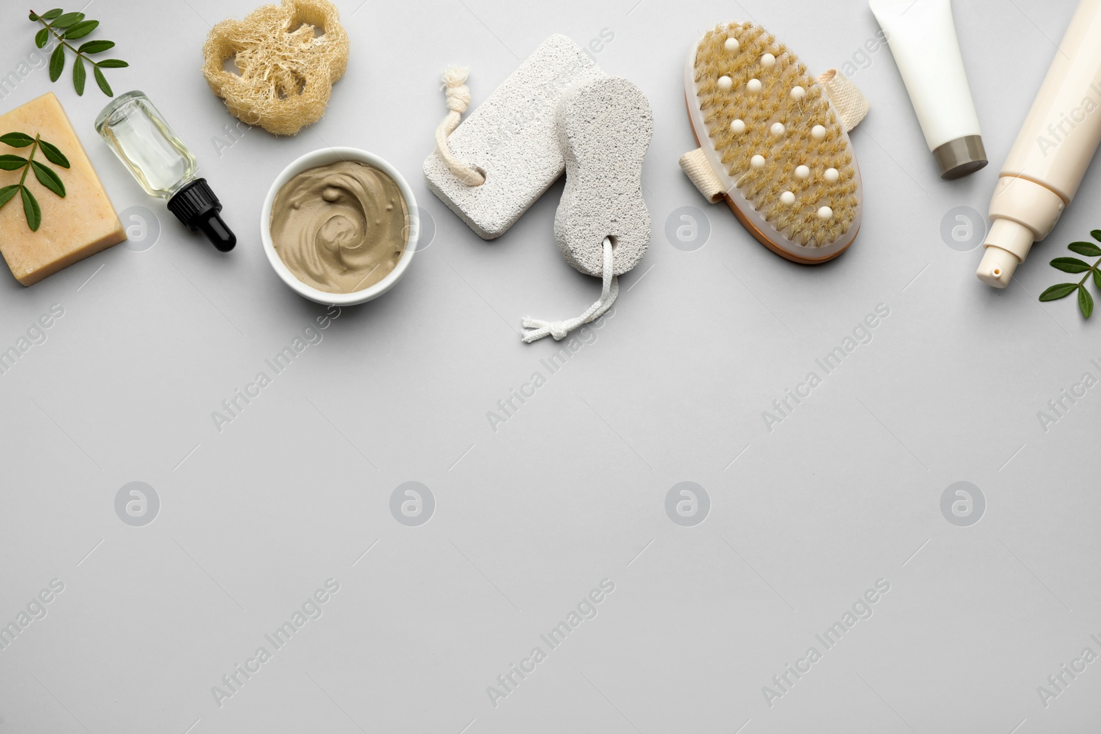 Photo of Flat lay composition with pumice stones on light grey background. Space for text